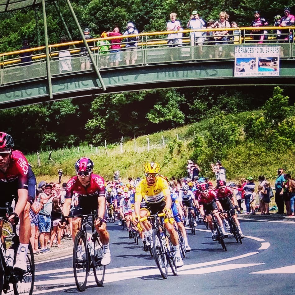 Julian Alaphilippe, in the yellow jersey, as the peloton passes Arreau, in the Pyrenees, Stage 12